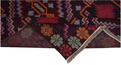 A handmade Afghan Pashm rug featuring geometric patterns and floral motifs in deep red and brown.