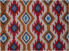 Handmade Afghan Pashm rug featuring a geometric pattern in red, blue, brown, and ivory wool.