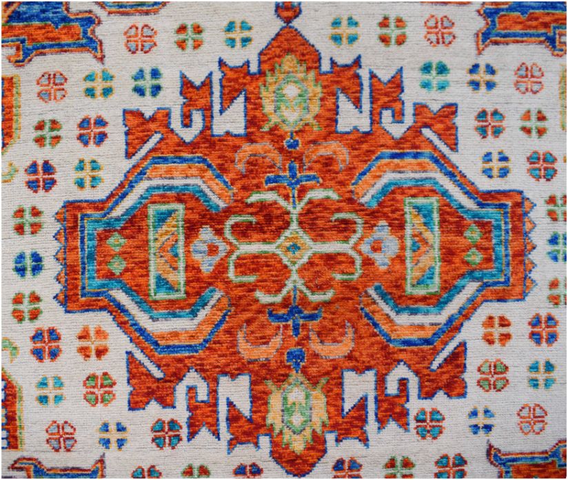 Handmade Afghan Pashm rug featuring a central orange medallion with intricate blue and green motifs.