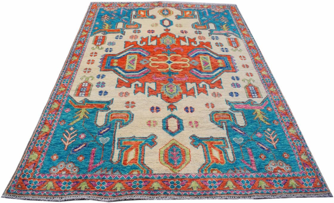 Handmade Afghan Pashm wool rug featuring a vibrant tribal pattern in blue, orange, and cream.