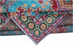 A handmade Afghan Pashm rug featuring a vibrant geometric pattern in blue, red, and green wool.