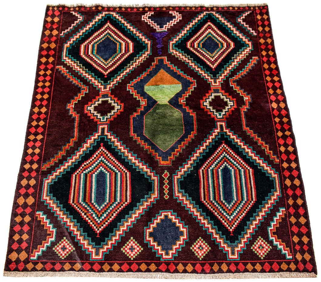 Handmade Afghan Pashm rug featuring geometric diamond patterns in dark red, blue, and ivory.