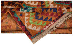 Handmade Afghan Pashm rug featuring a tribal geometric pattern in red, blue, green, and ivory.