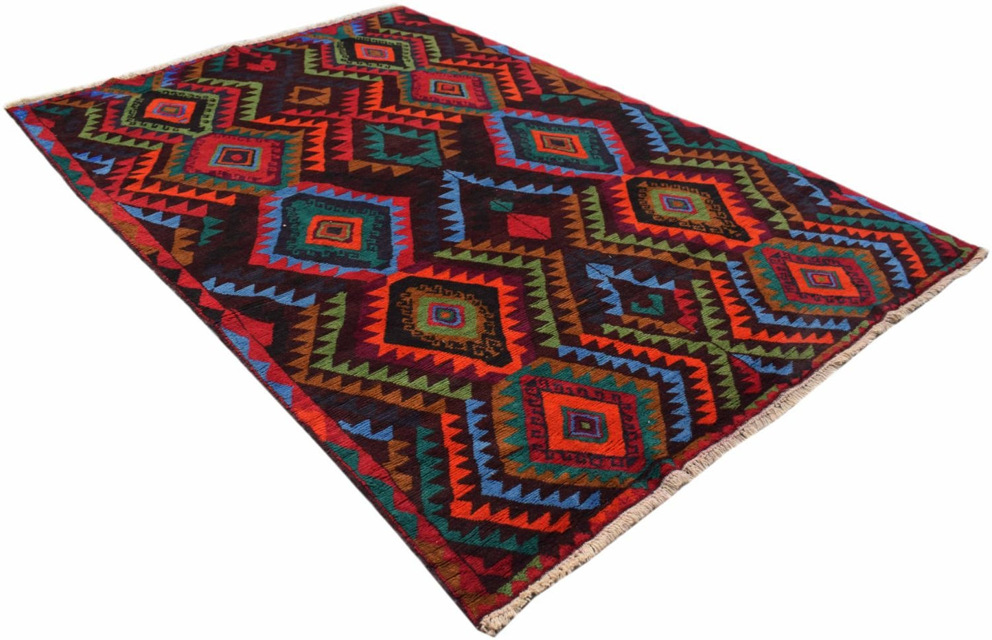 A handmade Afghan wool rug featuring a vibrant geometric diamond pattern in multi-colored tones.