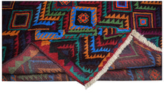 A handmade Afghan Pashm rug featuring a geometric tribal pattern in dark red, blue, and orange.