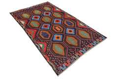 Handmade Afghan Pashm rug featuring a dark brown field with repeating geometric hexagon motifs.