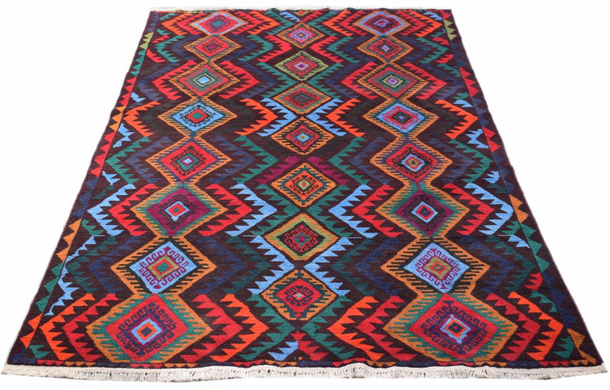 A handmade Afghan wool rug featuring a vibrant, repeating diamond pattern in multi-colored hues.