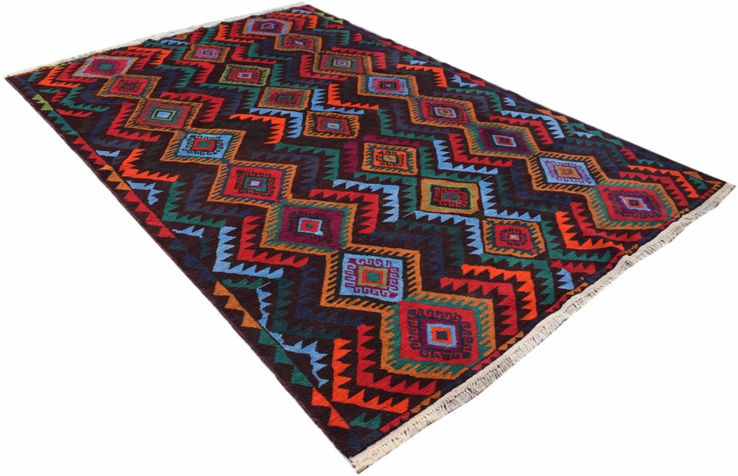 A handmade Afghan Pashm wool rug featuring a vibrant geometric diamond pattern on a dark background.