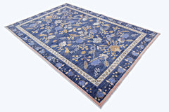 A rectangular handmade Afghan wool rug featuring a blue field with intricate floral patterns.