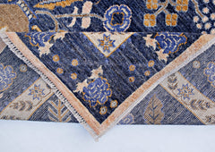 A handmade Afghan Pashm wool rug featuring a traditional blue and gold floral pattern.