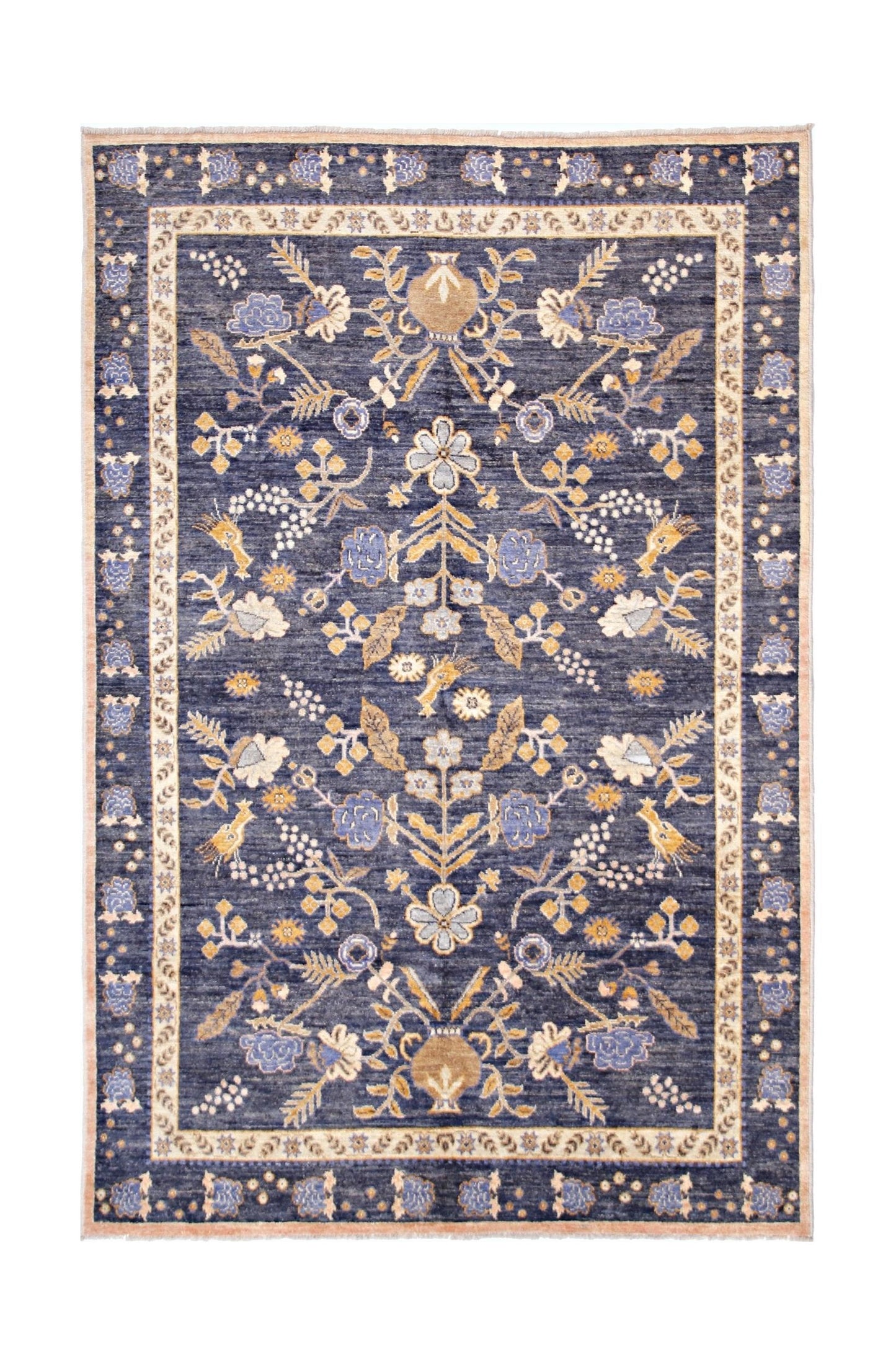 A handmade Afghan wool rug featuring a floral pattern in blue, cream, and gold tones.
