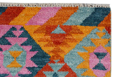 Handmade Afghan Pashm rug featuring a vibrant geometric pattern in orange, pink, and blue wool.