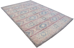 A handmade Afghan wool rug featuring a geometric tribal pattern in shades of blue, pink, and cream.