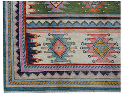 Handmade Afghan wool rug featuring colorful geometric tribal patterns on a cream background.