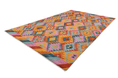 A handmade Afghan wool rug featuring a vibrant geometric diamond pattern in warm, colorful tones.