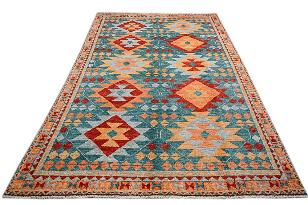 A handmade Afghan Pashm rug featuring a geometric diamond pattern in teal, orange, and red.