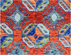 Handmade Afghan wool rug featuring a vibrant geometric pattern in orange, blue, and green.