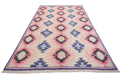 Handmade Afghan wool rug featuring a repeating geometric diamond pattern in pink, blue, and black.