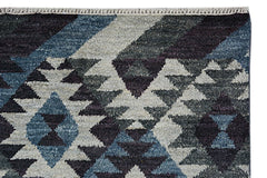 Handmade Afghan wool rug featuring a geometric pattern in shades of blue, grey, and dark purple.