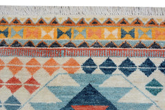 Handmade Afghan wool rug featuring a geometric tribal pattern in blue, orange, and cream tones.