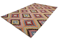 Handmade Afghan Pashm rug featuring a colorful geometric kilim pattern on a wool pile.