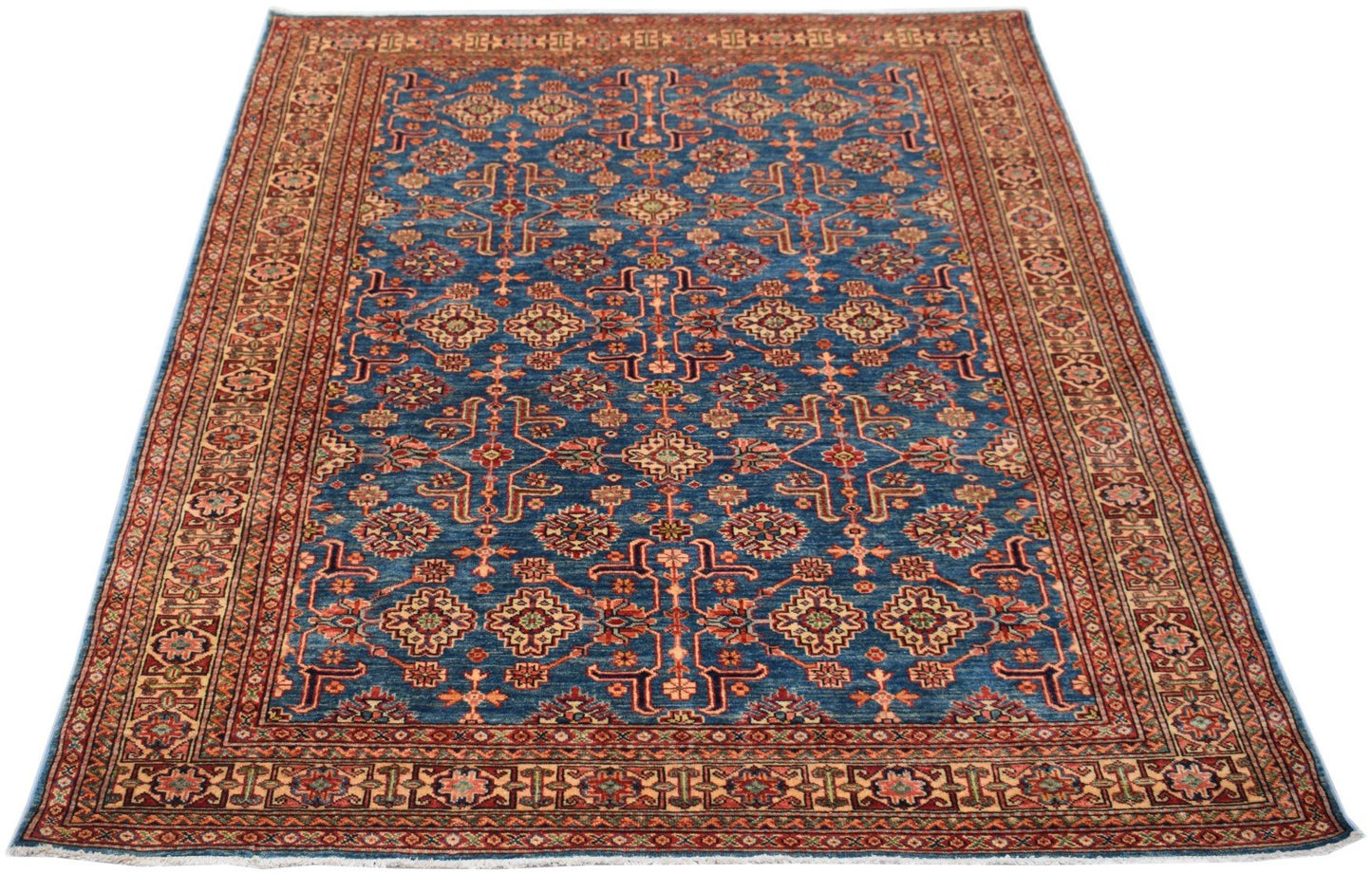 Handmade Afghan Super Kazakh rug featuring a traditional geometric pattern on a blue field.