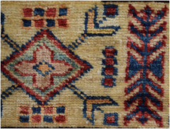 A close-up of an Afghan Super Kazakh rug featuring a geometric diamond pattern in red and blue.