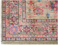 A handwoven Afghan Super Kazakh rug featuring a traditional geometric pattern in vibrant colors.