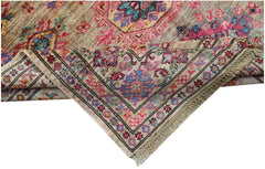 A handwoven Afghan Super Kazakh rug featuring a traditional geometric pattern in pink and blue.