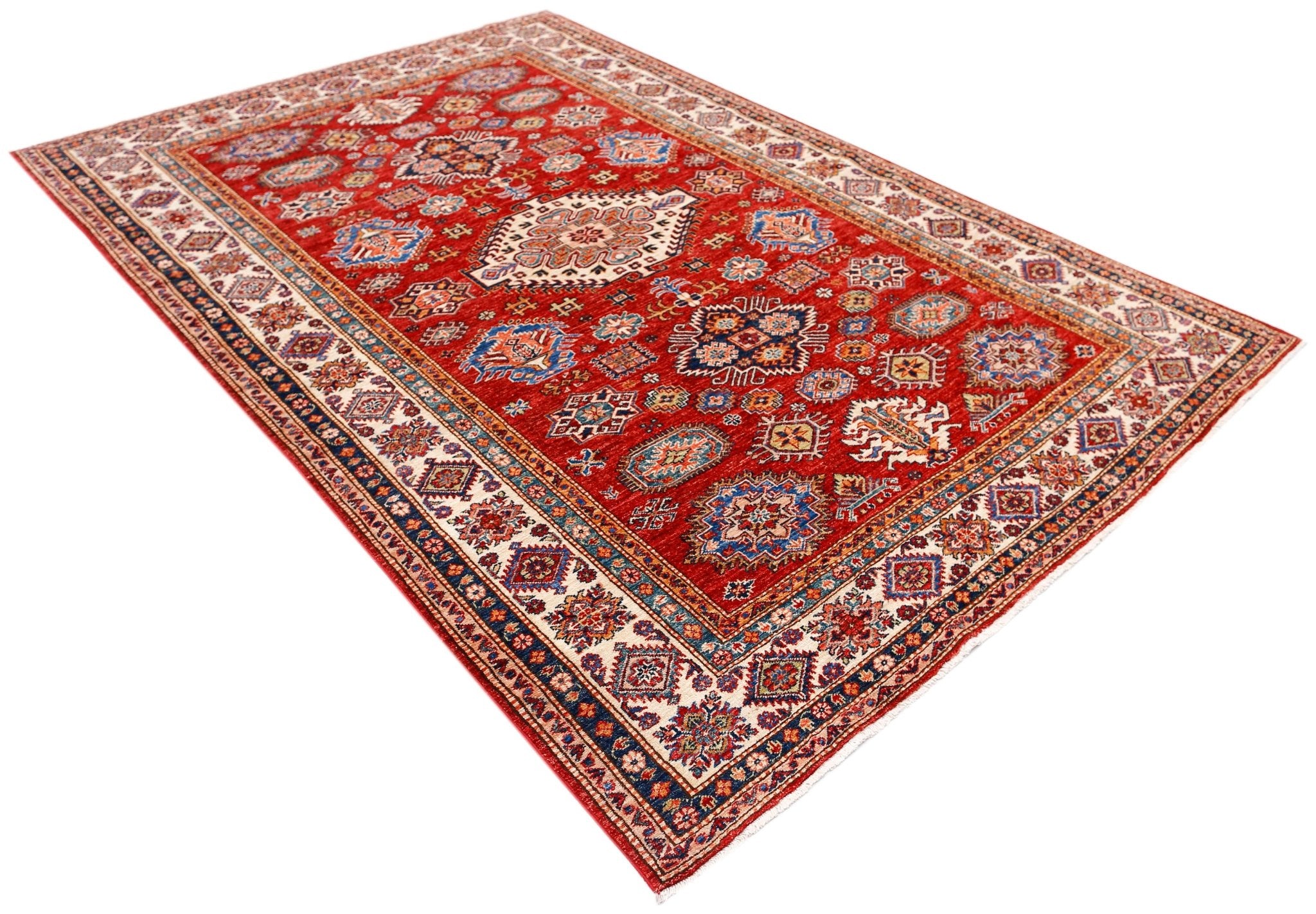 A handmade Afghan Super Kazakh rug featuring traditional geometric motifs in red, blue, and cream.