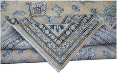 A handmade Afghan Super Kazakh rug featuring traditional blue and beige geometric patterns.