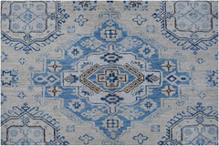 An Afghan Super Kazakh rug featuring a traditional blue and cream geometric medallion pattern.