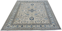 Handmade Afghan Super Kazakh rug featuring traditional blue and beige geometric patterns.