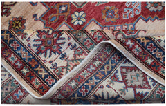 A handmade Afghan Super Kazakh rug featuring traditional geometric motifs in red, blue, and cream.