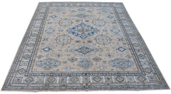A handmade Afghan Super Kazakh rug featuring traditional blue and beige geometric patterns.