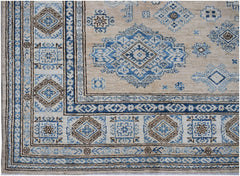 Handmade Afghan Super Kazakh rug featuring traditional blue and brown geometric motifs on beige.