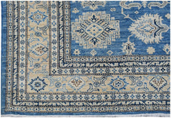 Handmade Afghan Super Kazakh rug featuring traditional geometric motifs in blue and cream tones.