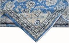 A handmade Afghan Super Kazakh rug featuring traditional blue and cream geometric patterns.