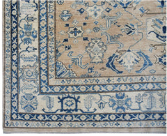 Handmade Afghan Super Kazakh rug featuring traditional blue geometric motifs on a tan background.