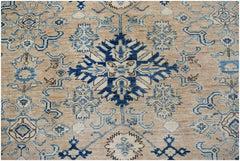 Handmade Afghan Super Kazakh rug featuring traditional blue geometric motifs on a tan wool field.
