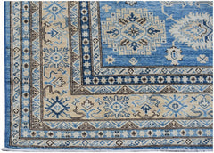 A handmade Afghan Super Kazakh rug featuring traditional geometric motifs in blue and beige.
