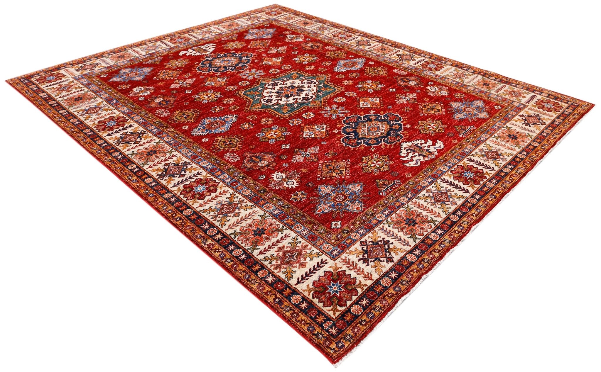 A handmade Afghan Super Kazakh rug featuring traditional geometric motifs on a red field.