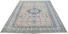 A rectangular Afghan Super Kazakh rug featuring traditional blue geometric motifs on a beige field.