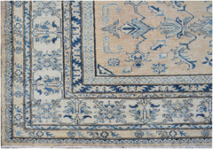 Handmade Afghan Super Kazakh rug featuring traditional blue geometric motifs on a beige field.