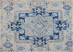 Handmade Afghan Super Kazakh rug featuring a geometric blue and cream medallion pattern.