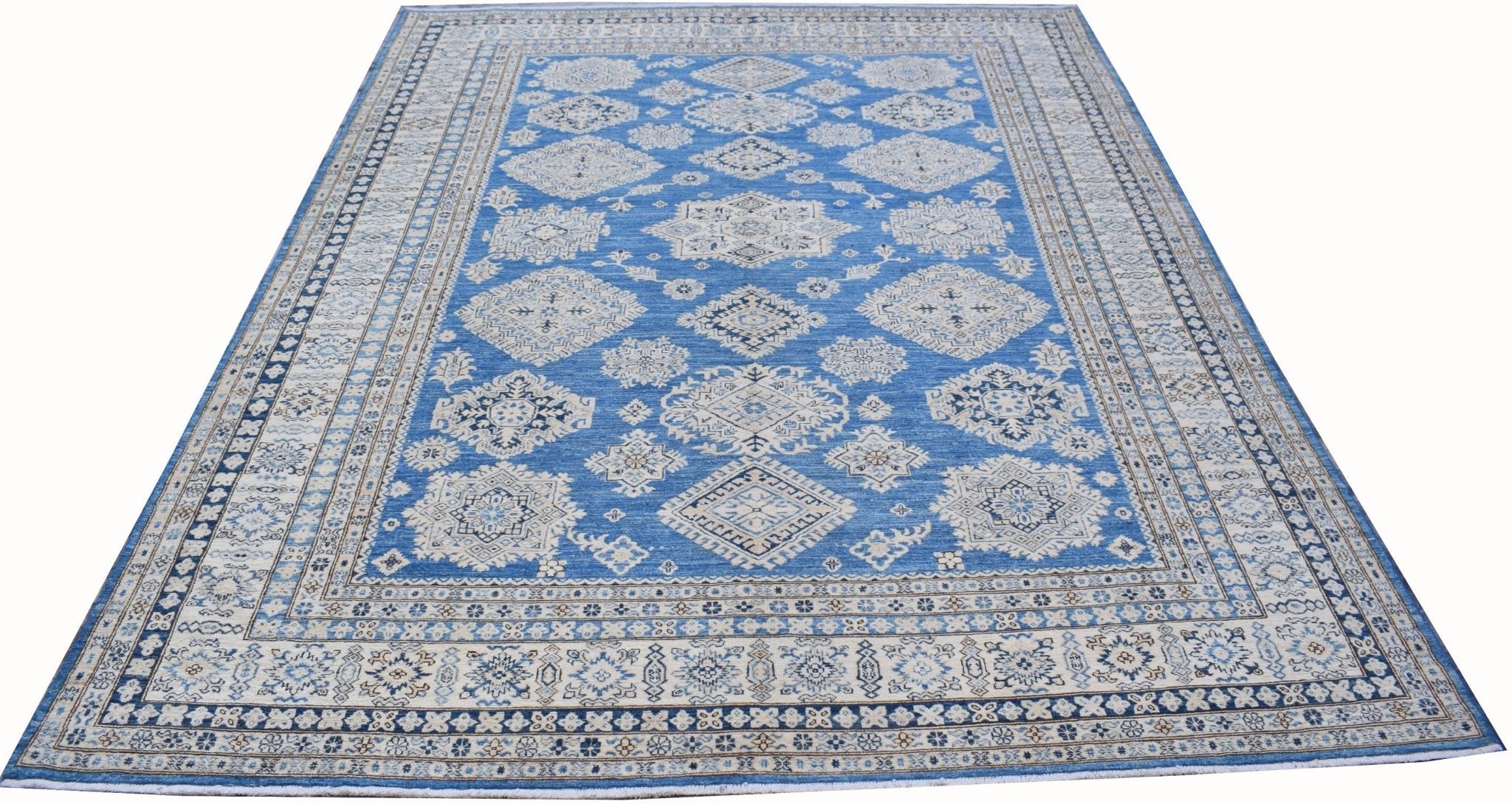 An Afghan Super Kazakh rug featuring traditional geometric motifs in blue and cream tones.