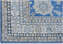 A handmade Afghan Super Kazakh rug featuring traditional blue and cream geometric patterns.