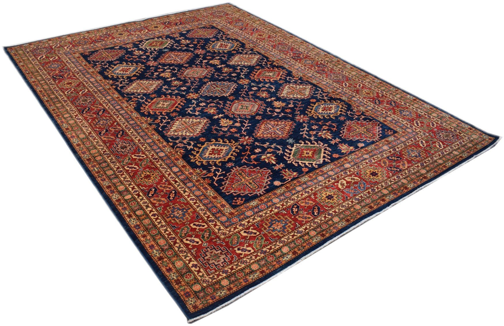 Handmade Afghan Super Kazakh rug featuring a dark blue field with geometric patterns and red borders.