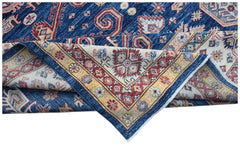 A handmade Afghan Super Kazakh rug featuring traditional geometric motifs in blue, red, and cream.