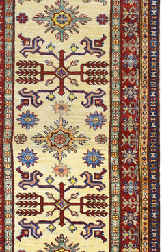 Handmade Afghan Super Kazakh runner rug featuring traditional geometric patterns in red and blue.